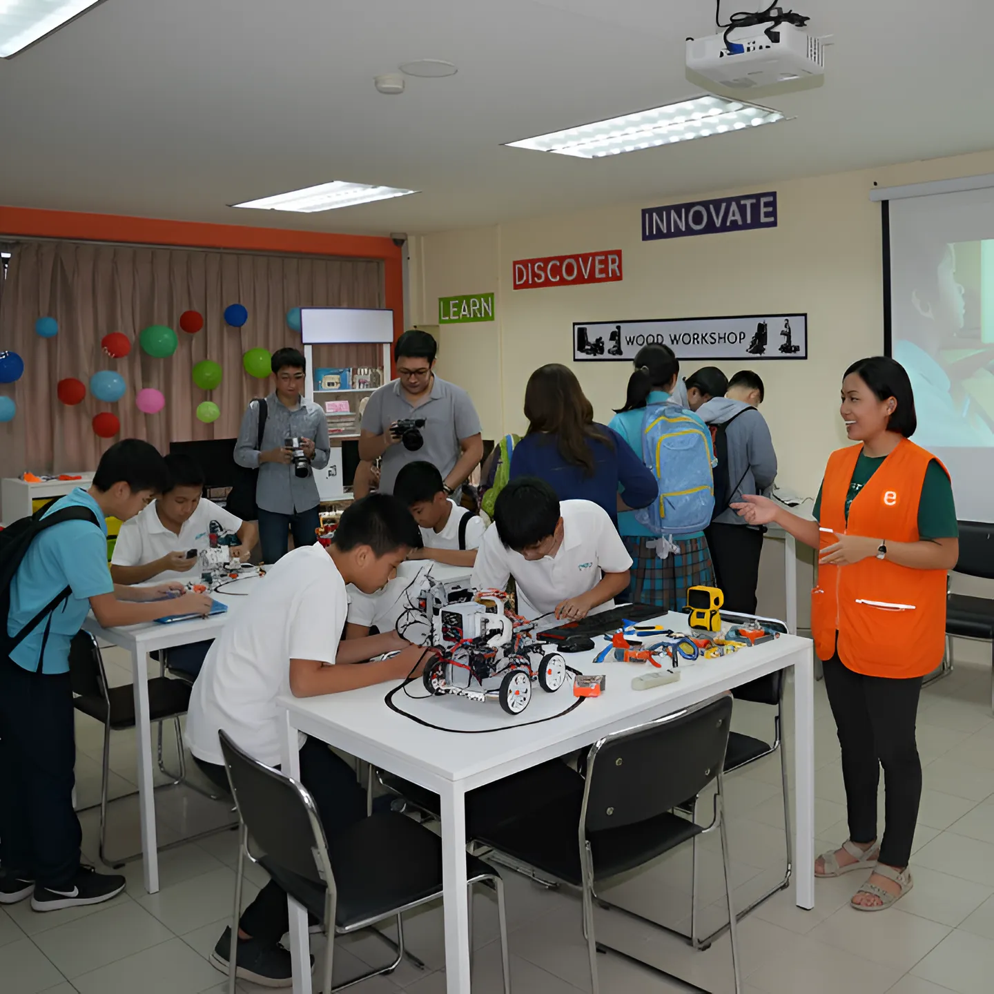 students in an educational tour in the Philippines participating in a maker lab activity